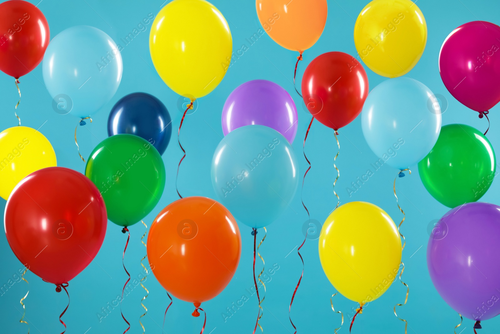 Photo of Bright balloons on color background. Celebration time