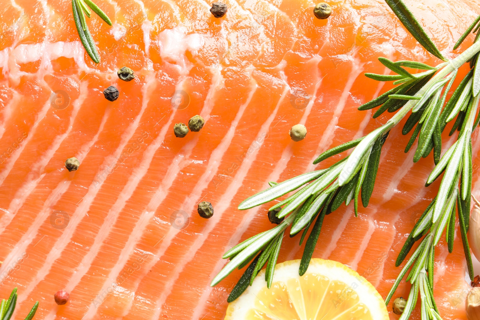 Photo of Raw salmon fillet and ingredients for marinade, closeup