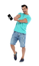 Photo of Happy young man taking selfie on white background