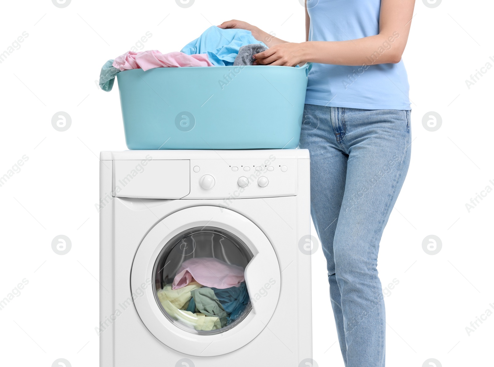 Photo of Woman with laundry near washing machine on white background, closeup