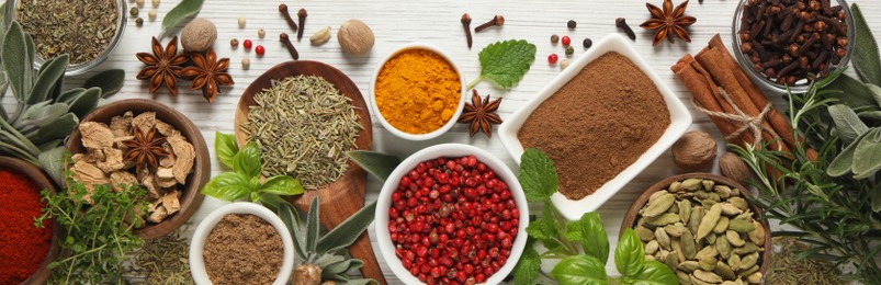 Image of Different fresh herbs and spices on white wooden table, flat lay. Banner design