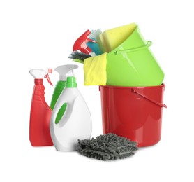 Plastic buckets and different cleaning supplies on white background