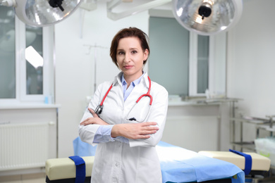 Photo of Portrait of professional doctor in modern surgery clinic. Space for text