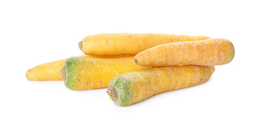 Photo of Fresh raw yellow carrots isolated on white