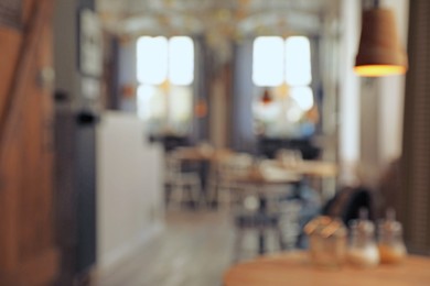 Photo of Blurred view of stylish cafe indoors. Bokeh effect