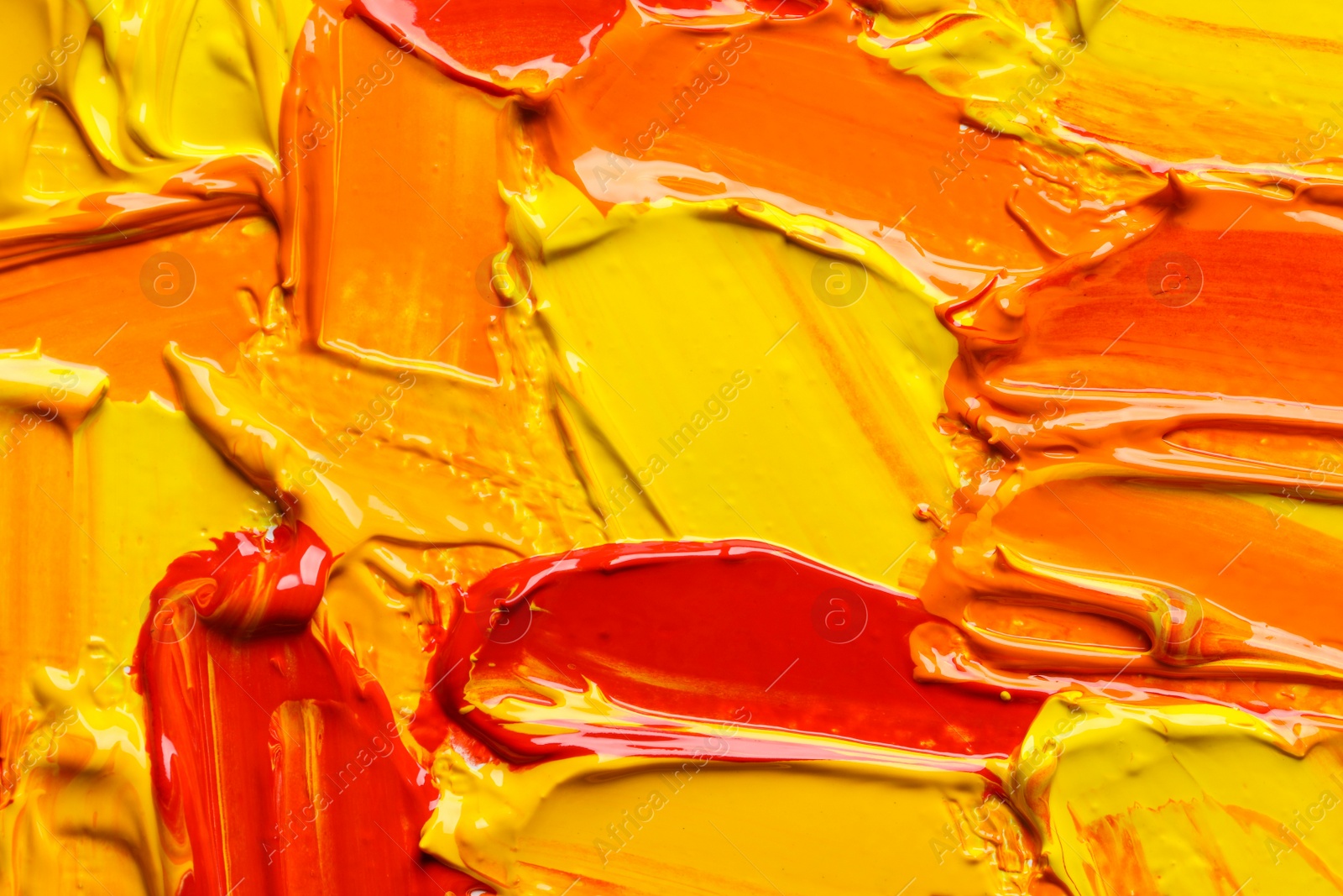 Photo of Beautiful strokes of colorful oil paints as background, closeup