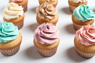 Photo of Delicious birthday cupcakes on white background, closeup