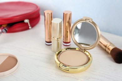 Photo of Set of luxury cosmetics on dressing table. Space for text