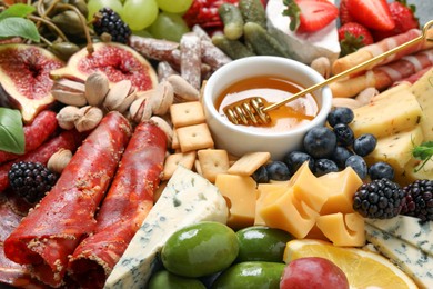 Photo of Set of different delicious appetizers as background, closeup
