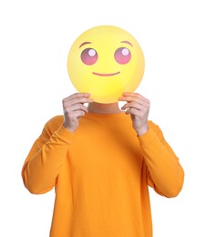 Photo of Man covering face with smiling emoticon on white background