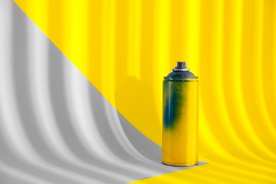 Photo of Used can of spray paint on color background. Space for text