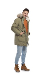 Photo of Young man wearing warm clothes on white background. Ready for winter vacation