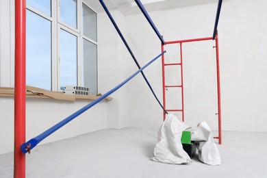 Photo of Empty building with ladder and beige walls during renovation