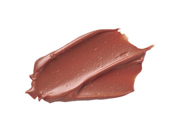Photo of Smear of tasty milk chocolate paste isolated on white, top view