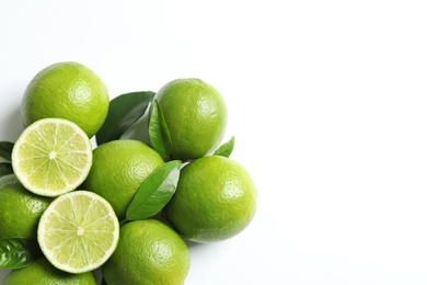 Photo of Fresh ripe limes on white background, top view