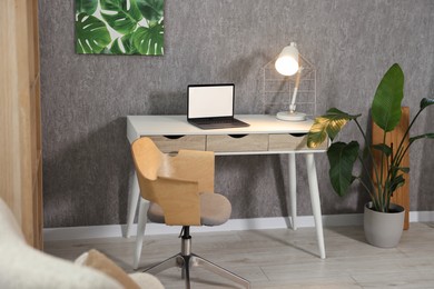 Photo of Home renovation. Room interior with stylish gray wallpaper on wall