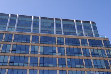 Photo of Low angle view of modern building on sunny day