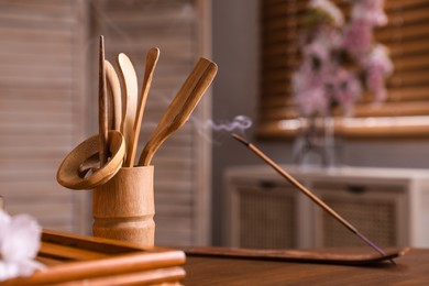 Photo of Tea vase with bamboo tools for traditional ceremony on table