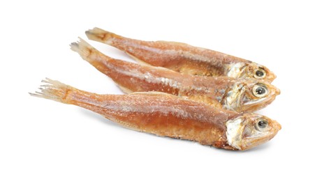 Photo of Delicious dried salted anchovies on white background