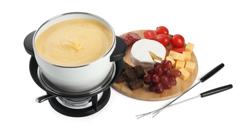 Photo of Fondue with tasty melted cheese, forks and different snacks isolated on white