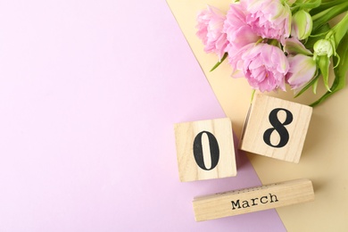 Photo of Date 8th of March and tulips on color background, flat lay with space for text. International Women's Day