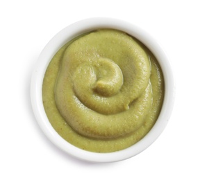 Photo of Delicious wasabi in bowl on white background, top view. Spicy sauce