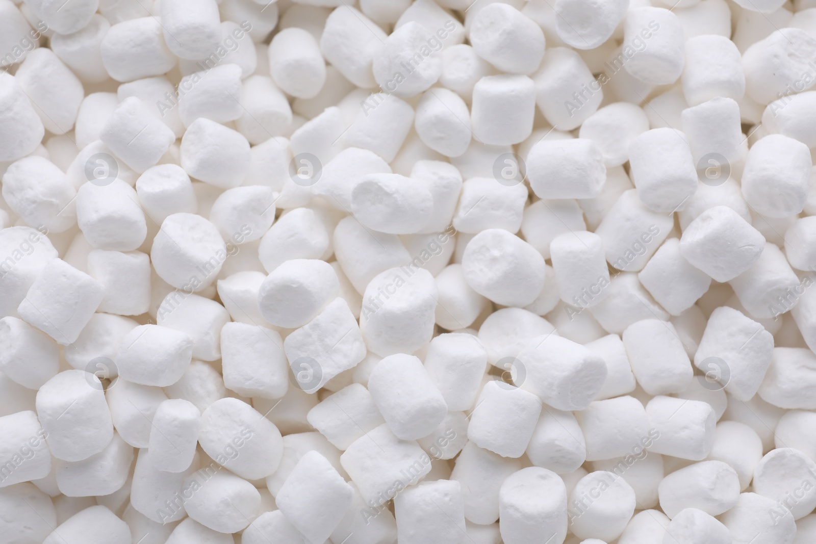 Photo of Many delicious sweet marshmallows as background, closeup