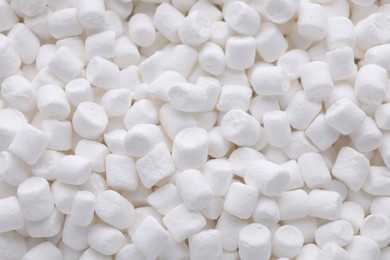 Photo of Many delicious sweet marshmallows as background, closeup