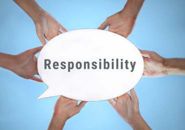 Image of Social responsibility concept. Group of people holding speech bubble lightbox on light blue background, closeup