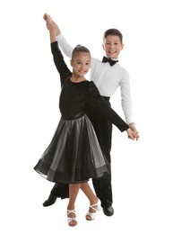 Photo of Beautifully dressed couple of kids dancing on white background