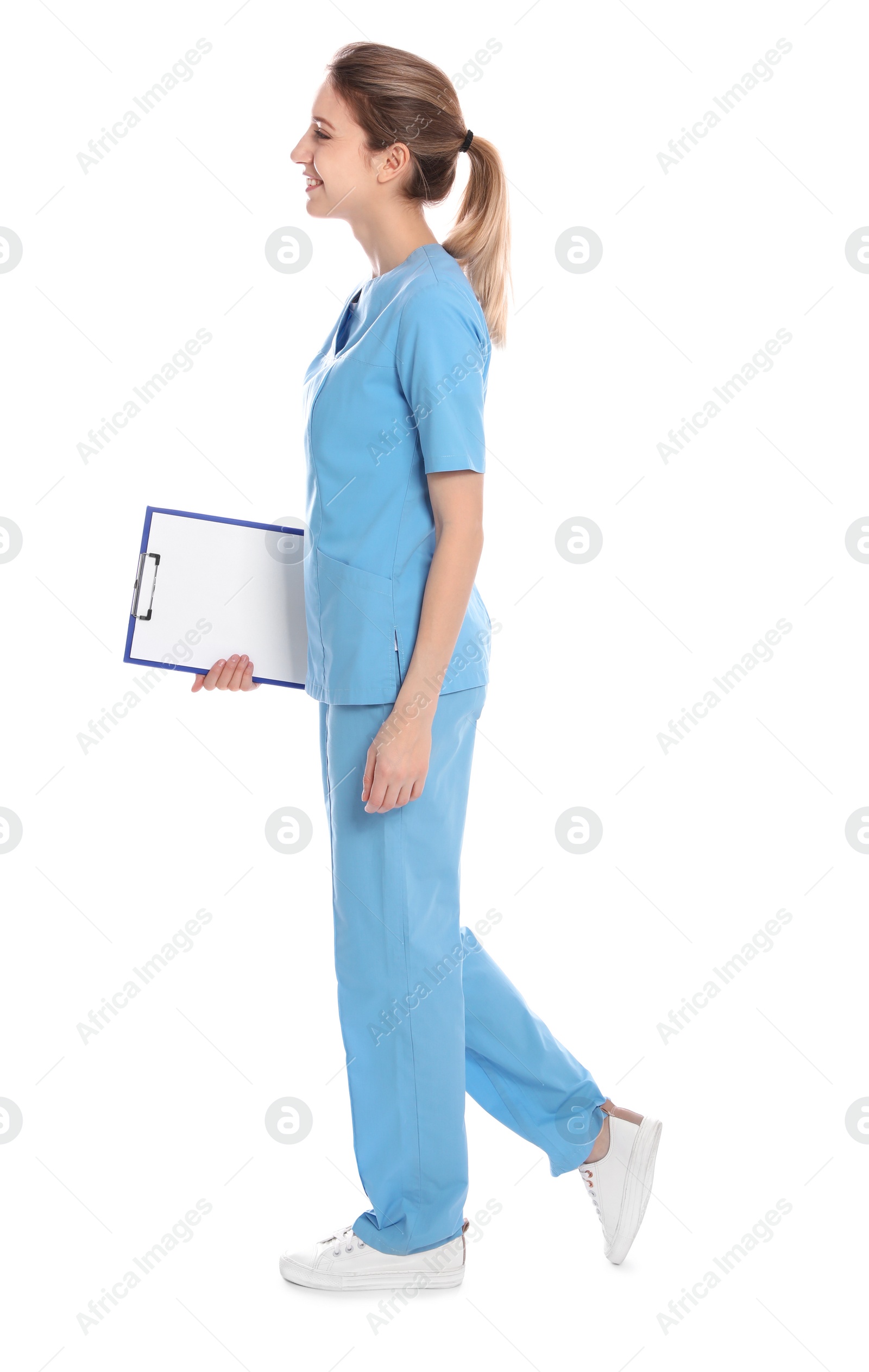 Photo of Full length portrait of medical doctor with clipboard isolated on white