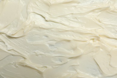 Photo of Texture of tasty butter as background, top view