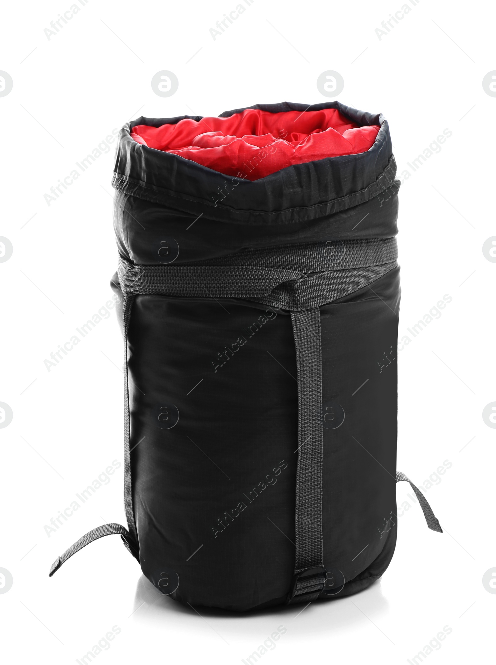 Photo of Sleeping bag in case on white background. Camping equipment