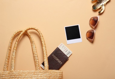 Flat lay composition with passport and beach objects on color background