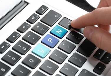 Image of VPN concept. Woman pressing button on computer keyboard, closeup