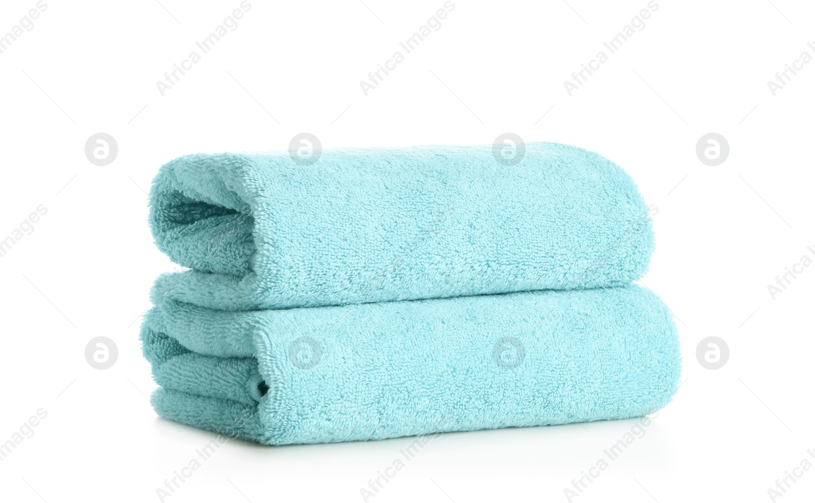 Photo of Stack of clean soft towels on white background