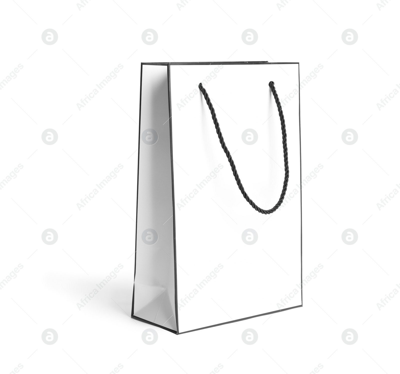 Photo of Paper shopping bag with handles on white background. Mockup for design