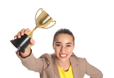 Photo of Portrait of happy young businesswoman with gold trophy cup on white background