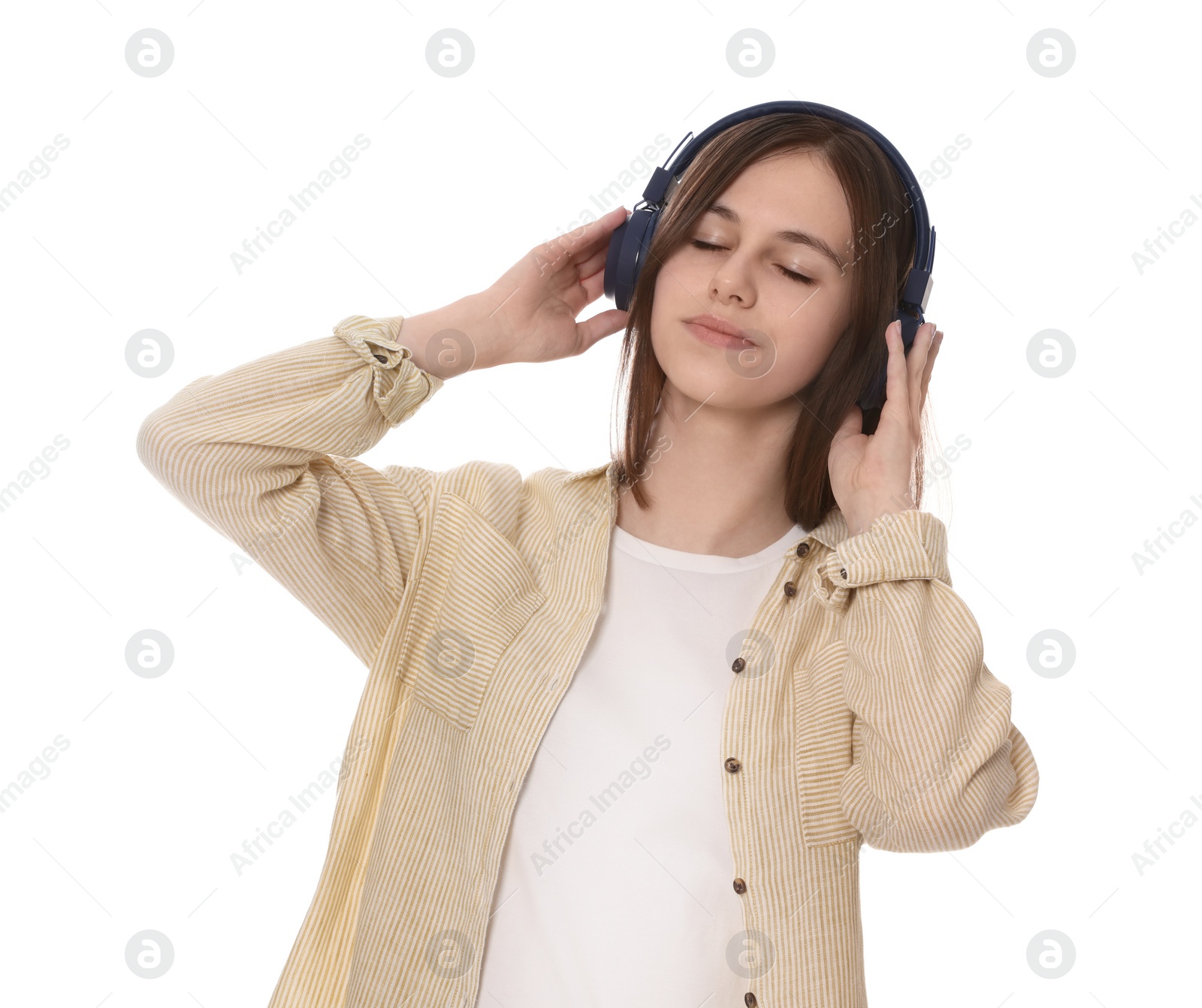 Photo of Teenage girl listening music with headphones on white background