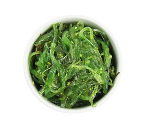 Japanese seaweed salad in bowl isolated on white, top view