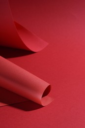 Photo of Paper sheets on red background, space for text