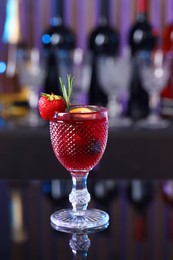 Glass of delicious refreshing sangria on counter in bar