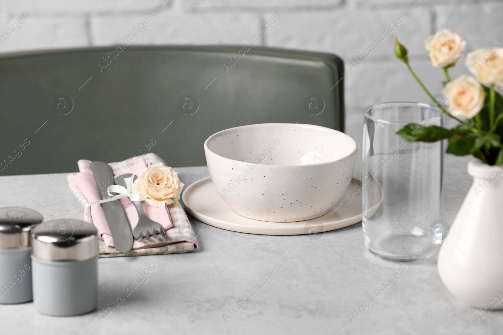 Photo of Beautiful table setting with fabric napkin and roses indoors