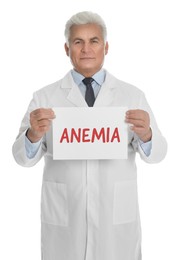 Image of Doctor holding sign with word ANEMIA on white background