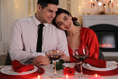 Photo of Happy couple having romantic dinner on Valentine's day in restaurant