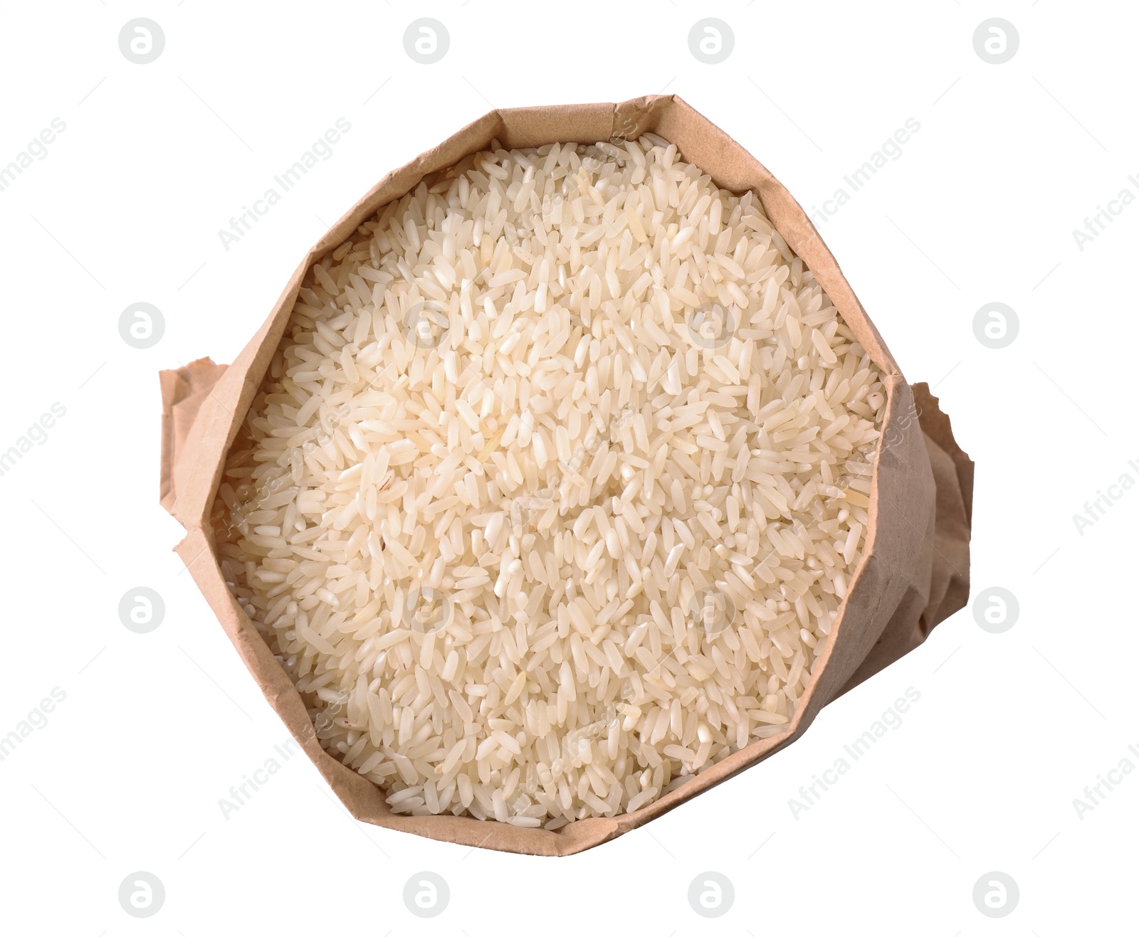 Photo of Uncooked rice in paper bag isolated on white, top view