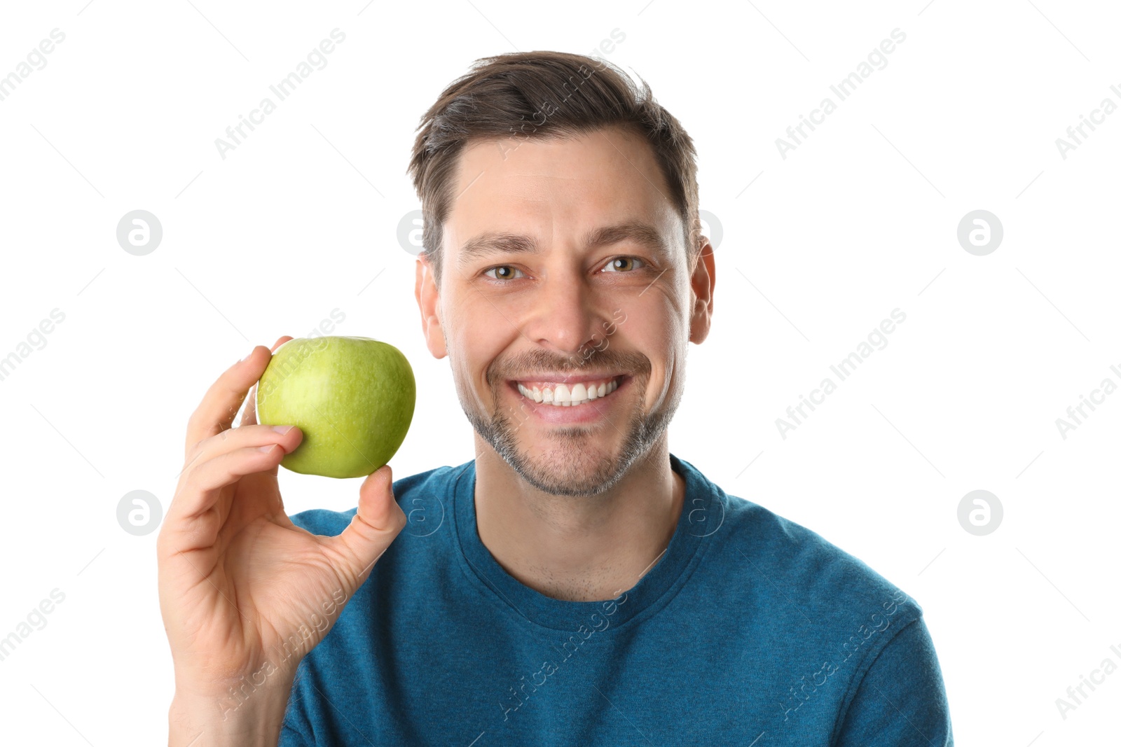 Photo of Man with perfect teeth and green apple on white background