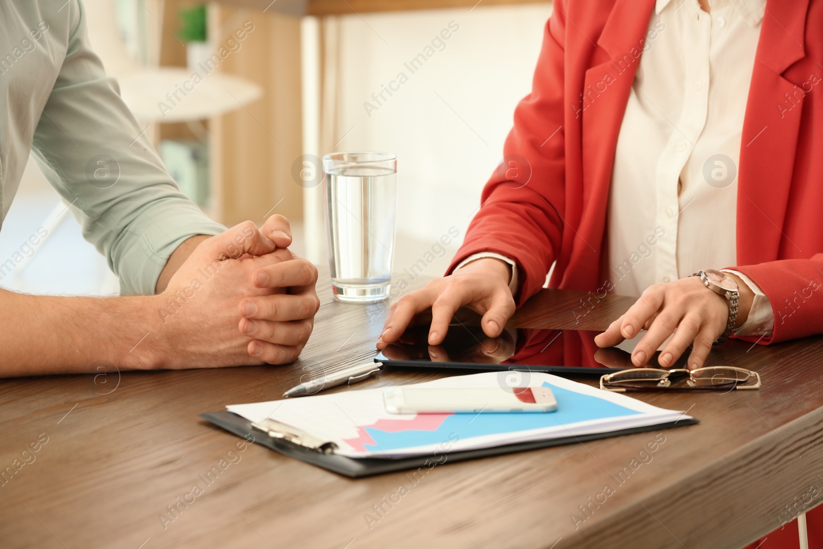 Photo of Man consulting with woman in office