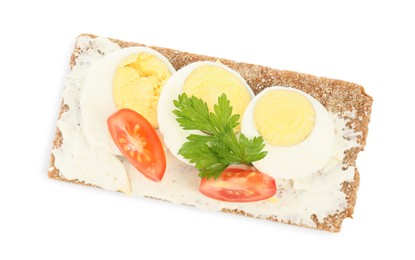 Photo of Fresh rye crispbread with boiled egg, cream cheese and tomato isolated on white, top view