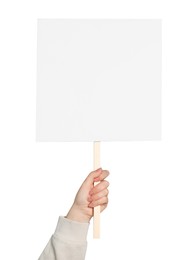 Woman holding blank protest sign on white background, closeup